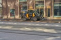 Finland. Helsinki. April 15, 2021 A mini tractor washes the sidewalk. Public cleaning