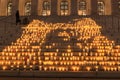 Finland, Helsinki. March 5, 2021. People light candles in front of the parliament building. Also, candles were lit all