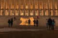 Finland, Helsinki. March 5, 2021. People light candles in front of the parliament building. Also, candles were lit all