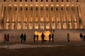 Finland, Helsinki. March 5, 2021. People light candles in front of the parliament building. Also, candles were lit all