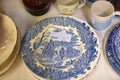 Plates of antique English porcelain in a commission shop