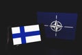 Finland and NATO flag in background. NATO flag in background