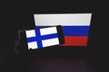 Finland and Russian flags on screens Finland wants to join NATO