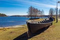 Finland. Savonlinna. Southern Savonia: Exhibit ancient boat on the lake at spring sunny day near the Lake Saimaa Nature and Museum Royalty Free Stock Photo