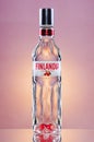 Finlandia natural flavoured cranberry vodka on gradient background. Royalty Free Stock Photo