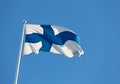 Finlands blue and white flag waving against blue sky Royalty Free Stock Photo