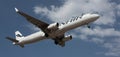 Finnair Airlines flies in the blue sky. Landing at Tenerife Airport