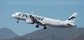 Finnair Airlines flies in the blue sky. Takeoff at Tenerife Airport