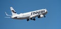 Finnair Airlines flies in the blue sky