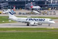 Finnair Embraer 190 airplane Stuttgart Airport in Germany Royalty Free Stock Photo