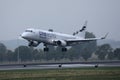 Finnair One World plane taking off from runway
