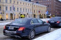 Finnish car with sign Taxi waits for passengers on street of Helsinki city, public transport concept used to transport passengers