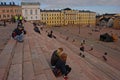 People relaxing at the steps stairs of Helsinki Cathedral in the Finnish capital, Finland