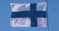 Finnish Flag Waving in the Wind against blue sky Royalty Free Stock Photo