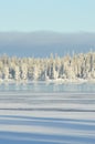 Finnish winter. Crystal clear cold winter day. Lake Porontima, Kuusamo.