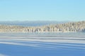 Finnish winter. Crystal clear cold winter day. Lake Porontima, Kuusamo.