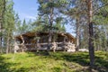 Finnish wooden loghouse in the forest of Lapland Royalty Free Stock Photo