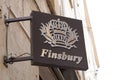 Finsbury sign text store and brand logo of boutique chic men boys shop Goodyear shoes Royalty Free Stock Photo