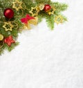 Fir branch with Christmas decorations on the background of natural snow Royalty Free Stock Photo