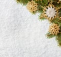 Fir branch with Christmas decorations on the background of natural snow Royalty Free Stock Photo