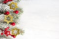 Fir branch with Christmas decorations on old wooden shabby background with copy space for tex Royalty Free Stock Photo