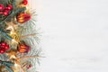 Fir branch with Christmas decorations on old wooden shabby background with copy space for text Royalty Free Stock Photo