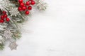 Fir branch with Christmas decorations on old wooden shabby background with copy space for text Royalty Free Stock Photo