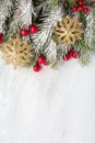 Fir branch with Christmas decorations on old wooden shabby background with copy space for text. Top view Royalty Free Stock Photo