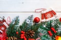 Fir branch with Christmas decorations on old wooden white background with copy space for text Royalty Free Stock Photo