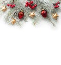 Fir branch with Christmas decorations on white background. Top view Royalty Free Stock Photo