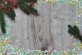 Fir branch and multi-colored confetti. Royalty Free Stock Photo