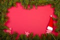 Fir branches as frame, red background with christmas decoration