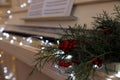 Fir branches with berries on piano keys indoors, space for text. Christmas music Royalty Free Stock Photo