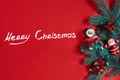 Fir branches border on red background, good for christmas backdrop. The inscription - Merry Christmas Royalty Free Stock Photo