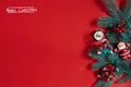 Fir branches border on red background, good for christmas backdrop. The inscription - Merry Christmas Royalty Free Stock Photo