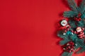 Fir branches border on red background, good for christmas backdrop Royalty Free Stock Photo