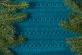 Fir tree as frame on knitted sweater background. Christmas concept. Abstract pattern. Royalty Free Stock Photo