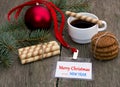 Fir-tree branch, coffee, oatmeal cookies and label Christmas