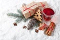 Fir tree branch, decorations, gingerbread cookies and gift boxes on a winter snow background with copy space. Royalty Free Stock Photo