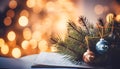 Fir tree branch and festive decor on music sheets, bokeh effect