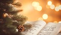 Fir tree branch and festive decor on music sheets, bokeh effect