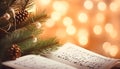 Fir tree branch and festive decor on music sheets, bokeh effect