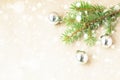 Fir tree branches decorated with silver christmas balls as border on a snow rustic holiday background frame Royalty Free Stock Photo