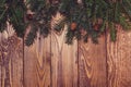 Fir tree branches on rustic wooden background. Christmas holiday Royalty Free Stock Photo