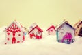 Fir tree decoration: handmade houses with Christmas ornaments Royalty Free Stock Photo