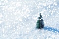 Fir tree toy with lights on snow background. Christmas and New Year holidays celebration concept Royalty Free Stock Photo