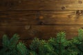 Fir tree twigs on wooden background. Christmas concept Royalty Free Stock Photo