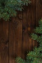 Fir tree twigs on wooden background. Christmas concept Royalty Free Stock Photo