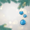 Fir twigs and blue Christmas balls with snowflakes ornament with space for greeting text. Christmas decoration elements. Royalty Free Stock Photo