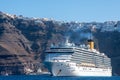 Cruise Ship Costa Deliziosa of Costa cruises facing forward with Fira in background